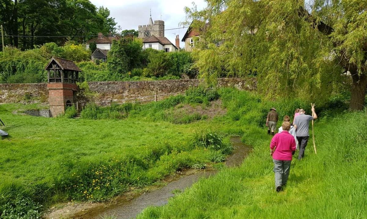 Walkers by St Eadburgs Well